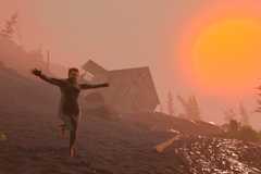 Baby Steps’ main character Nate, wearing an adult onesie, loses his balance and starts to tumble off a muddy hill.